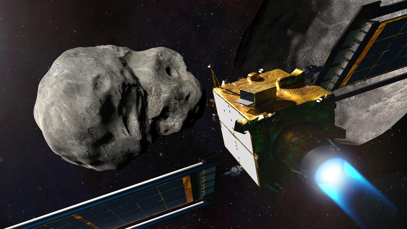 An illustration of the DART spacecraft and the asteroid