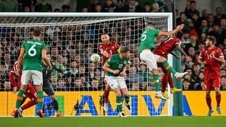 John Egan of Republic of Ireland heads his side's first goal