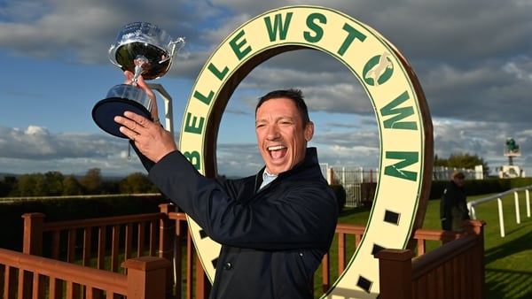 Frankie Dettori hoists the Barney Curley Charity Cup aloft