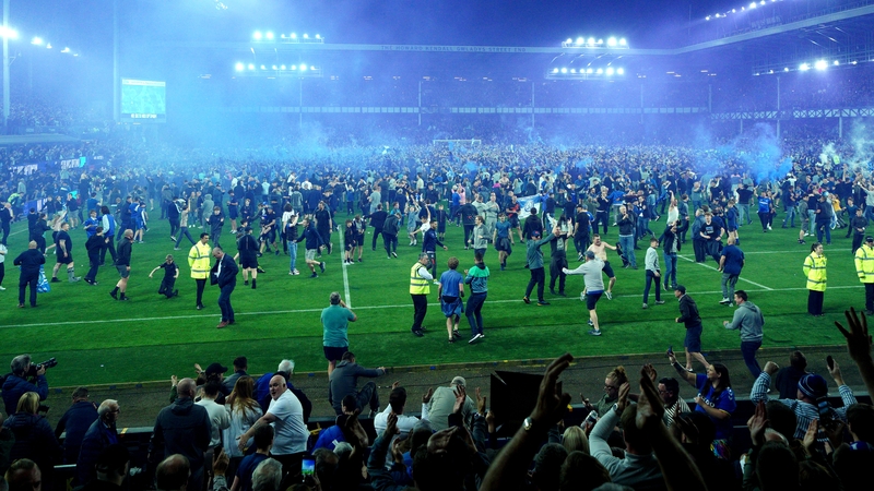 Everton fans celebrate after the Premier League survival was guaranteed