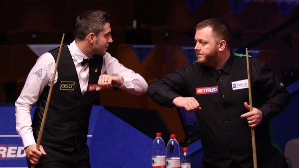 Mark Selby (left) greets Mark Allen