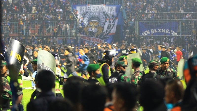 Fans invade the pitch at Kanjuruhan Stadium