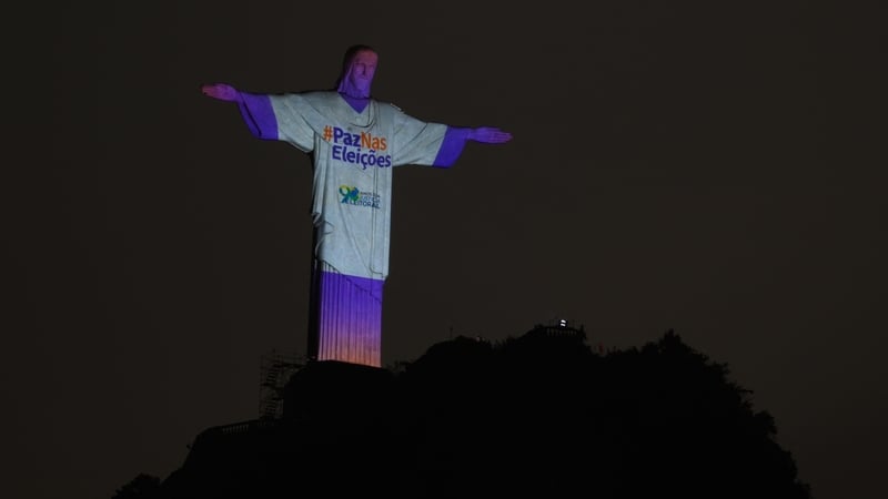Christ the Redeemer statue is illuminated reading 'Peace in the Elections' in Rio de Janeiro