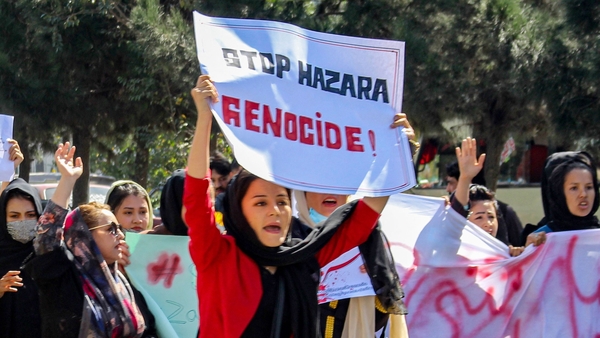 Afghan women display placards and chant slogans a day after a suicide bomb attack at Dasht-e-Barchi learning centre in Kabul