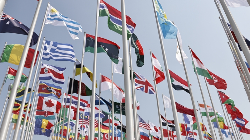 Different countries' flags are hoisted ahead of the World Cup in the Corniche region in Doha, Qatar