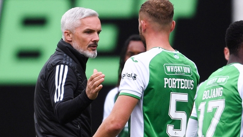 Goodwin shakes hands with Hibernian's Ryan Porteous at full time