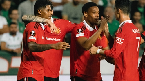 Marcus Rashford (L) and Cristiano Ronaldo (R) celebrate with Anthony Martial after his goal