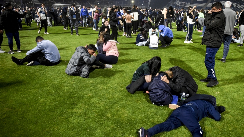 Fans fled onto the pitch in chaotic scenes at Juan Carmelo Zerillo Stadium