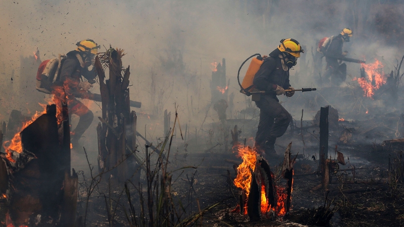 Firefighters tackle blazes in the Amazon