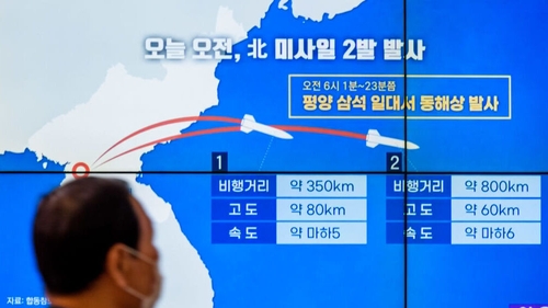 A TV screen in Seoul shows a news program reporting North Korea's missile launches on Thursday