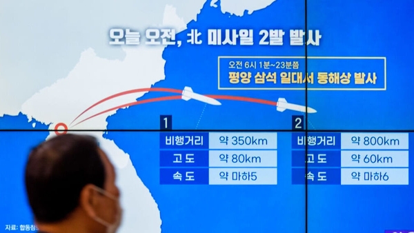 A TV screen in Seoul shows a news program reporting North Korea's missile launches on Thursday
