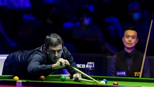 Ronnie O'Sullivan held off a Marco Fu fightback on a record day for snooker