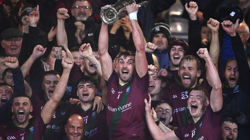 Portarlington captain Keith Bracken hoists the Jack Delaney Cup aloft