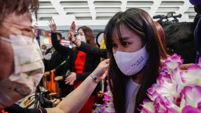 Holidaymakers from Thailand were greeted with flower garlands when they arrived shortly after midnight