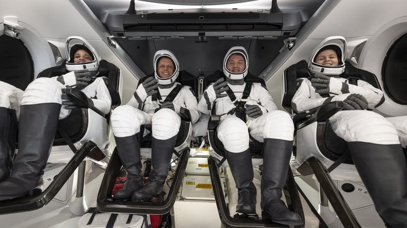 NASA astronauts (L-R) Jessica Watkins, Robert Hines, Kjell Lindgren, and European Space Agency astronaut Samantha Cristoforetti are seen inside the SpaceX Crew Dragon Freedom spacecraft