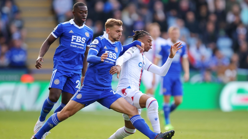 Michael Olise of Crystal Palace battles for possession with Kiernan Dewsbury-Hall