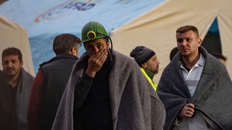 Relatives and friends of mine workers wait outside after an explosion in Amasra in Turkey