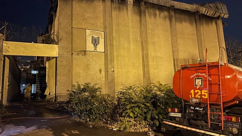 This image obtained from the Iranian news agency IRNA shows a fire truck in front of the Evin prison