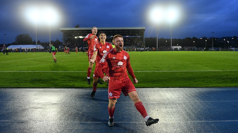 Shelbourne players make their way over to the travelling fans at full-time