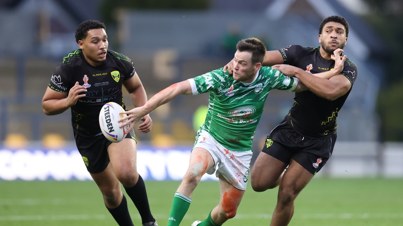 Luke Keary looks to break past AJ Wallace and Jacob Ogden of Jamaica