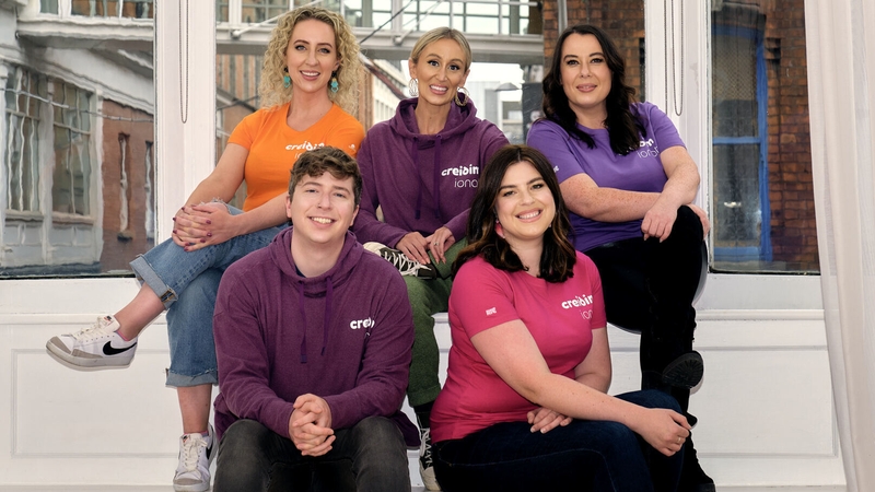 Beo ar Éigean with their mentees, Marissa Carter and Michael Fry.