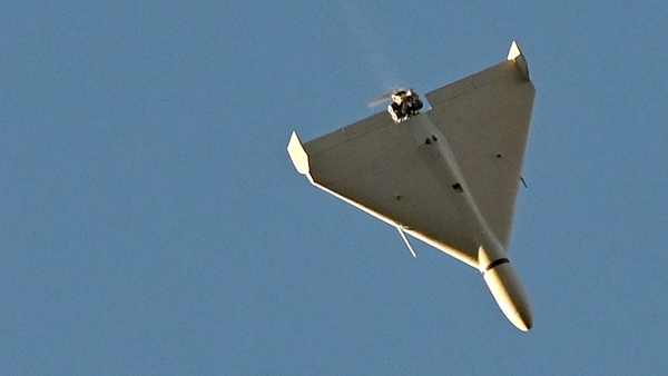 A drone flies over Kyiv during this morning's attack