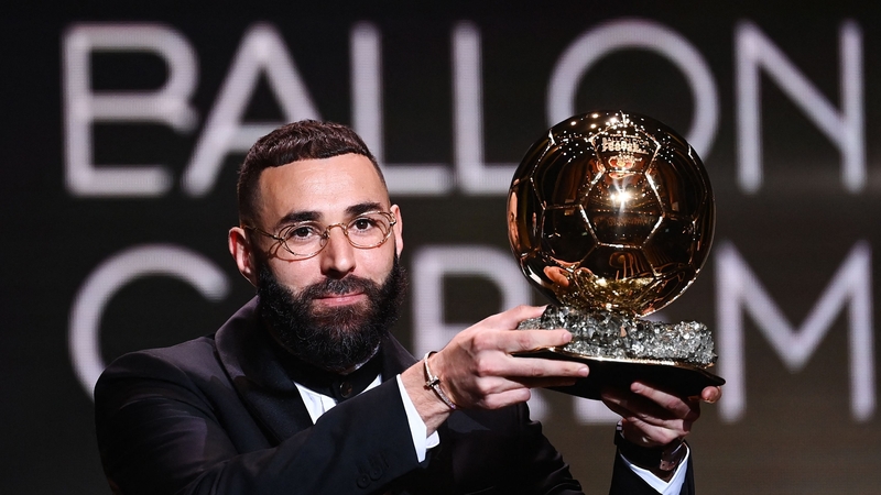 Real Madrid's French forward Karim Benzema receives the Ballon d'Or award