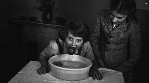 Dunking for apples at Halloween. Photo: The Schools' Collection by Dúchas © National Folklore Collection UCD licensed under CC BY-NC 4.0