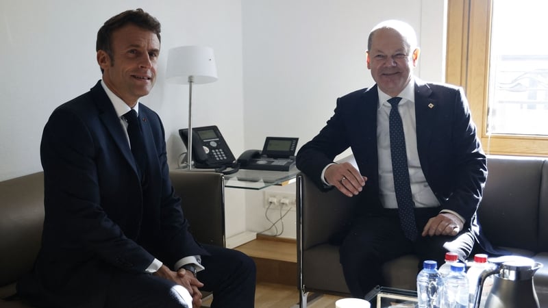 French President Emmanuel Macron and German Chancellor Olaf Scholz meet on the sideline of the summit earlier today