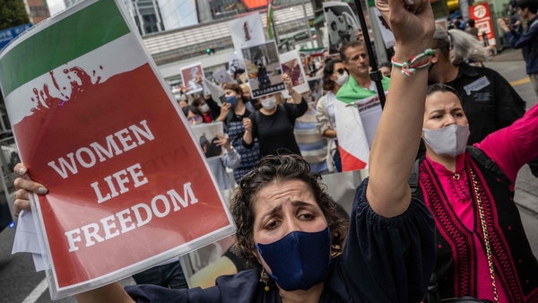 People protest over the death of Mahsa Amini in the Shibuya district of Tokyo