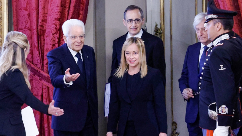 Italian President Sergio Mattarella (2nd L) welcomes new Prime Minister Giorgia Meloni (C) as she arrives for the swearing-in ceremony
