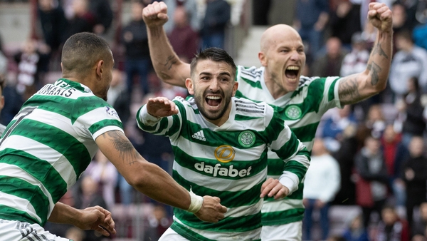 Greg Taylor (C) celebrates his winner