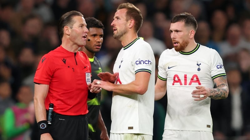 Harry Kane reacts toward referee Danny Makkelie after VAR disallowed his stoppage time goal
