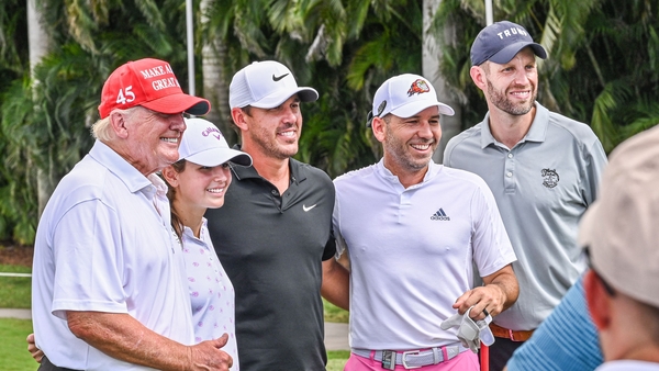 Donald Trump poses for a photo with Brooks Koepka and Sergio Garcia at the LIV Golf season finale in Miami