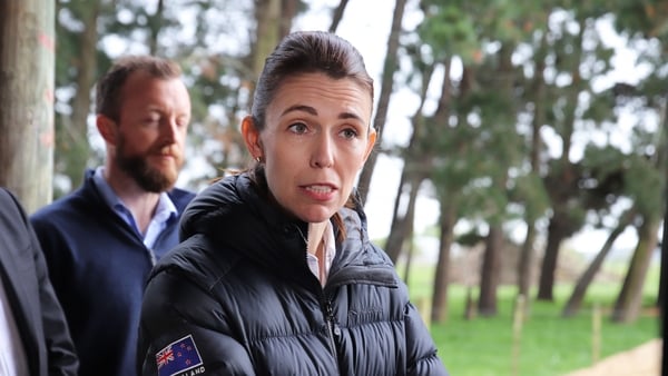 Jacinda Ardern talks to reporters on a farm visit to announce the government's proposals to tackle climate change earlier this month