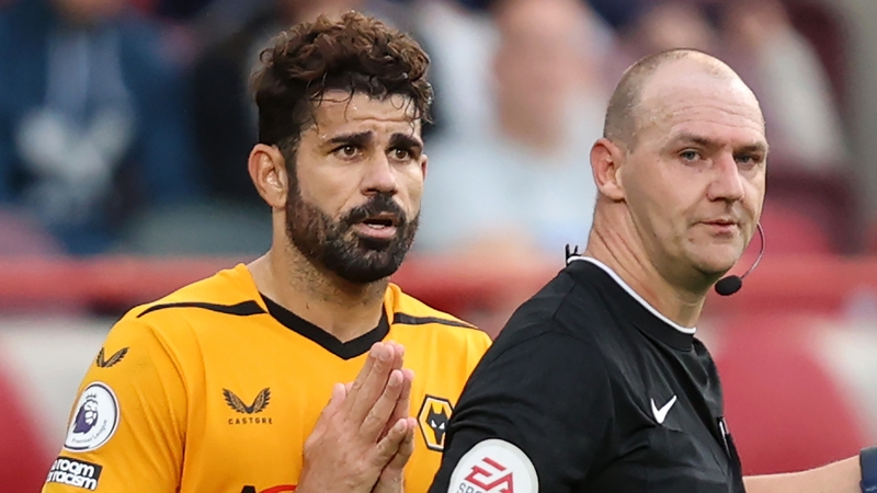 Diego Costa protests after receiving a red card from referee Bobby Madley