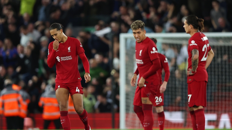 Liverpool players Virgil van Djik (L), Roberto Firmino and Darwin Nunez (R) after Leeds grabbed a late winner