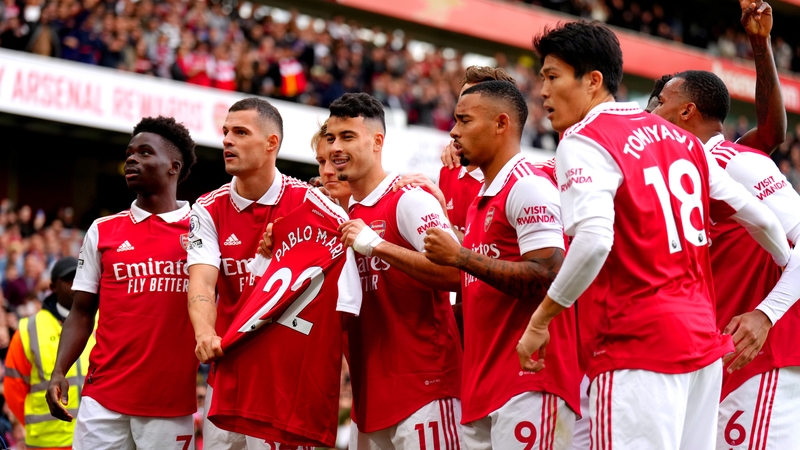 Gabriel Martinelli (centre) holds up former team-mate Pablo Mari's shirt during the Premier League game against Nottingham Forest
