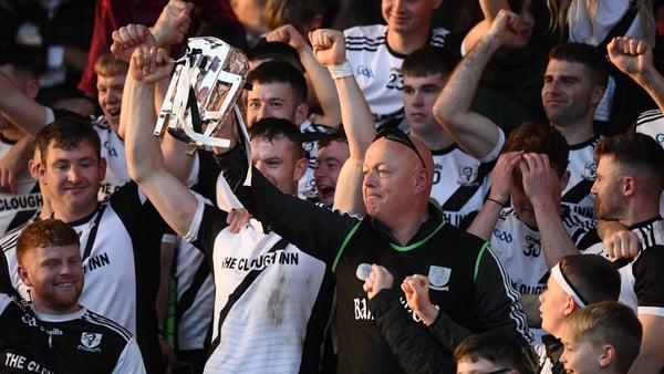 Kilruane MacDonaghs manager Liam O'Kelly holds the trophy aloft
