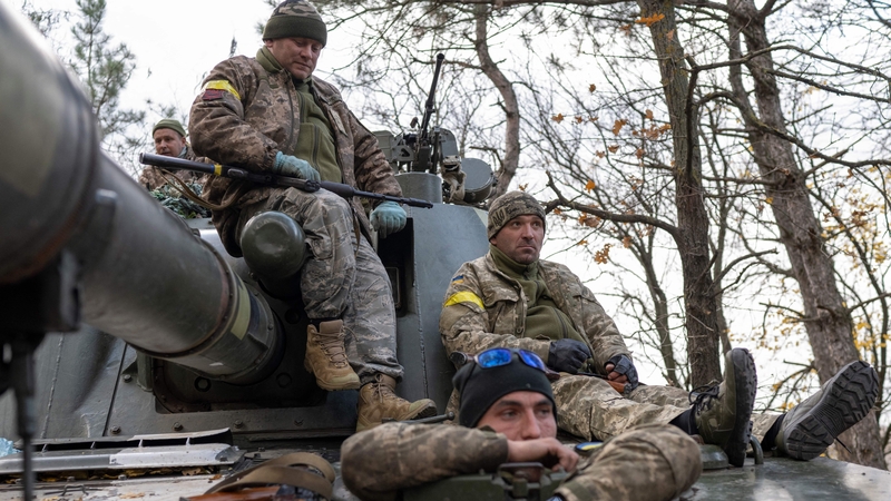 Ukrainian artillery unit members prepare to fire towards Kherson