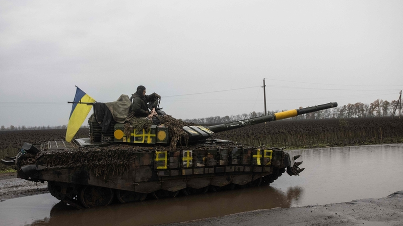 A Ukrainian serviceman stands on a tank near Borivske, Kharkiv region