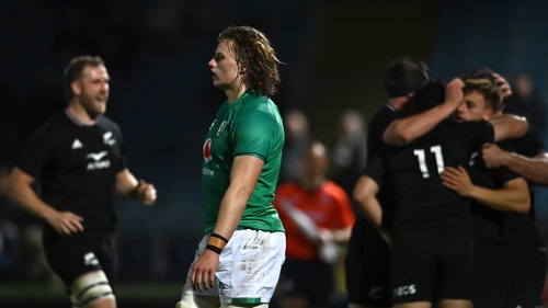 Cian Prendergast looks on after New Zealand run in one of their seven tries