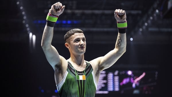 Rhys McClenaghan celebrates after winning gold