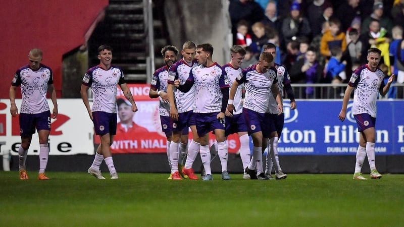 Anto Breslin, centre, celebrates with team-mates after scoring St Pat's third goal