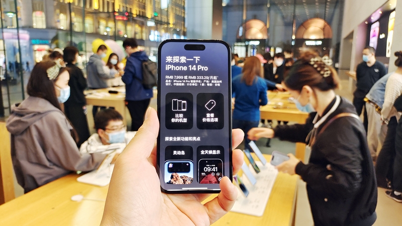 Customers try new iPhone 14 at Apple's flagship store in Shanghai, China