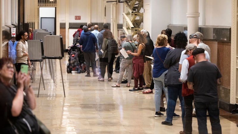 Voters who need to make corrections to their mail-in ballots line up at Philadelphia's City Hall on the eve of the US midterm elections