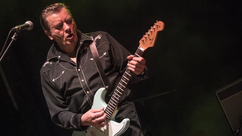 Garry Roberts on stage with The Boomtown Rats in Cortona, Italy in July 2017