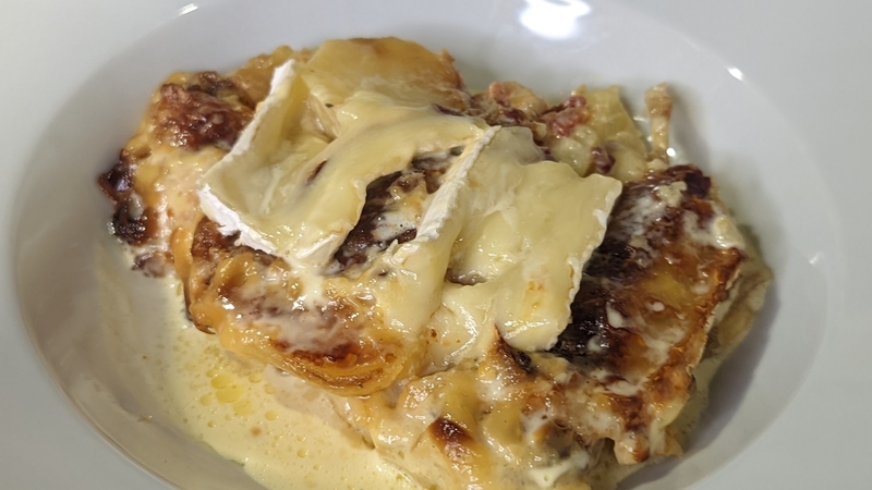 French potato dish with cheese, bacon and onion.