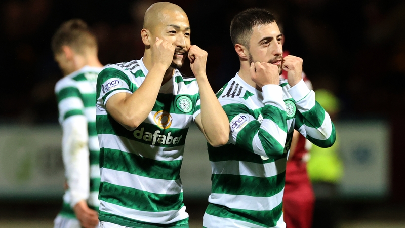 Daizen Maeda (L) celebrates with Josip Juranovic after scoring Celtic's second goal
