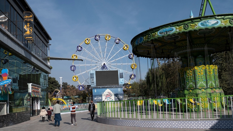People pictured walking in City Park in Kabul this week